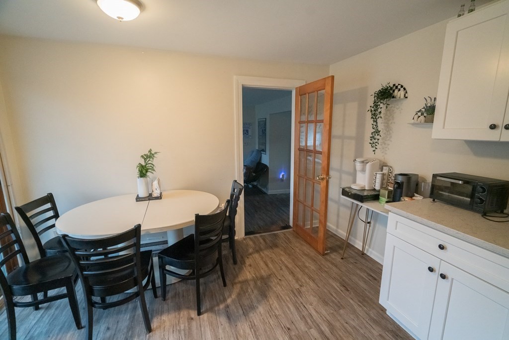 370 Pelham Road Amherst, MA 01002 - Photo 7 of 13 a view of a dining room with furniture and wooden floor
