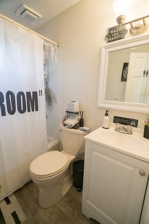 370 Pelham Road Amherst, MA 01002 - Photo 10 of 13 a bathroom with a toilet sink and mirror