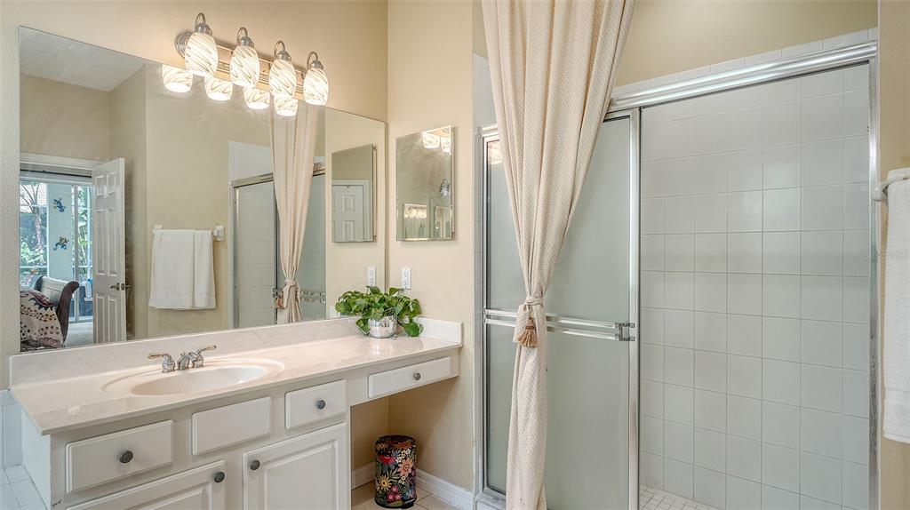 7717 US Open Loop Lakewood Ranch, FL 34202 - Photo 22 of 95 a bathroom with a double vanity sink and mirror