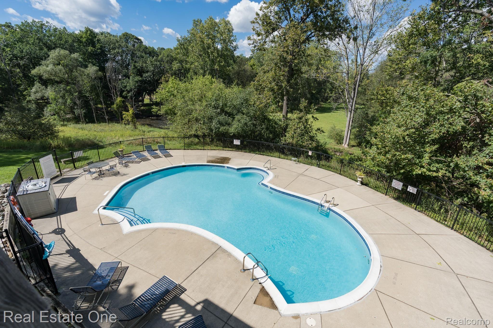 1677 Riverside Drive, Unit 16 Rochester, MI 48309 - Photo 31 of 31 SPECTACULAR VIEWS FROM THE CLUBHOUSE BALCONY AND POOL AREA - 1677 Riverside MLS-W050.jpg