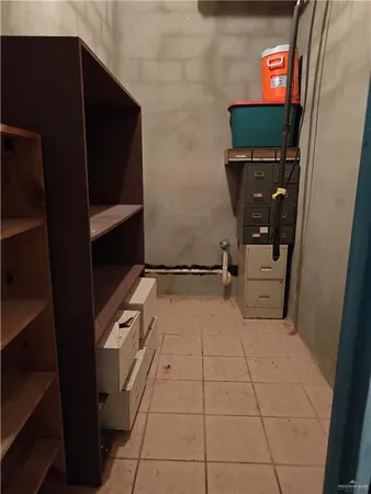 a bedroom with a bed and a table