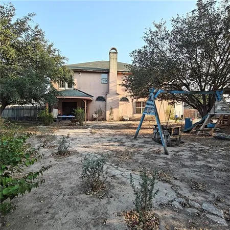 a view of house with trees in the background