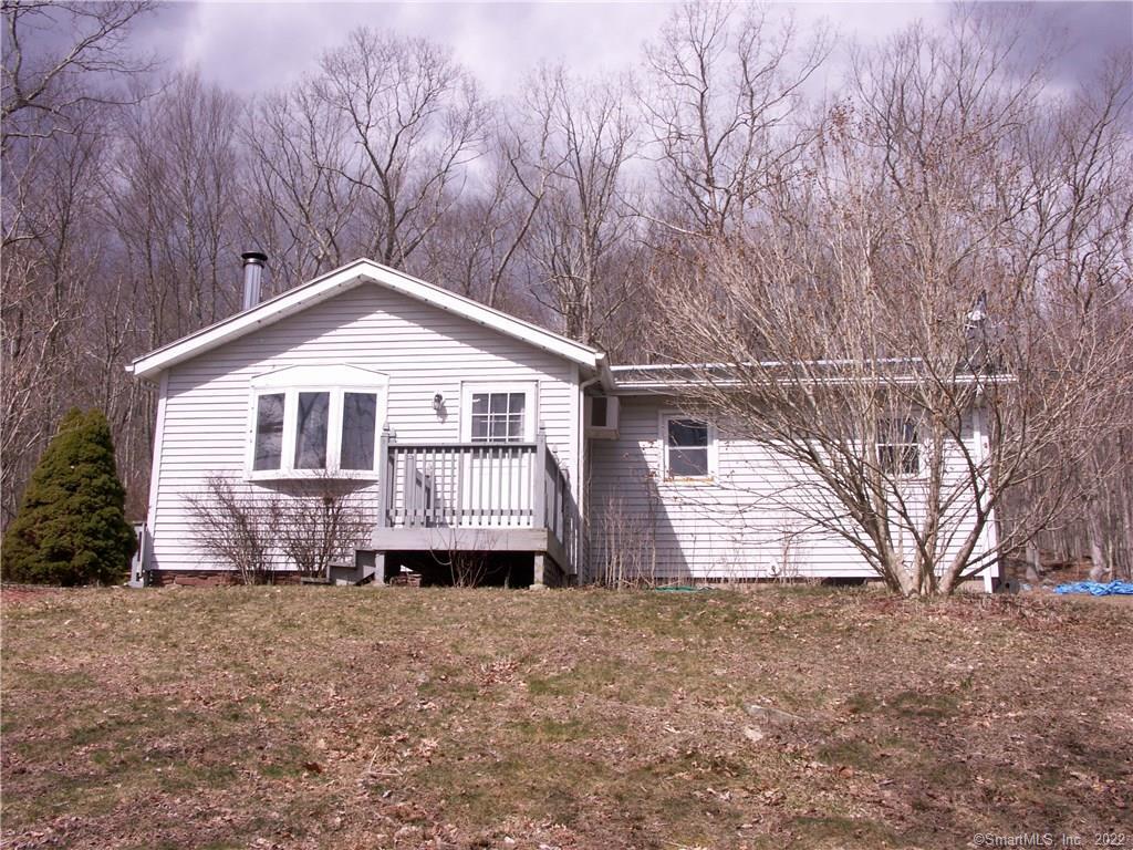 26 Westminister Road Sprague, CT 06330 - Photo 1 of 1 a front view of a house with a yard and garage