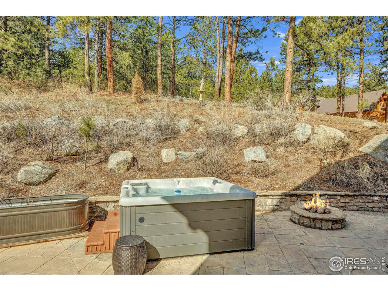 745 Sugarloaf Road Boulder, CO 80302 - Photo 14 of 37 Patio with hot tub and fire pit.