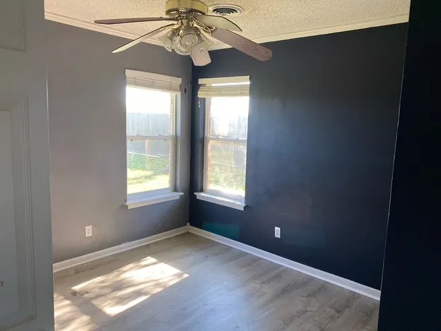 a view of an empty room and window