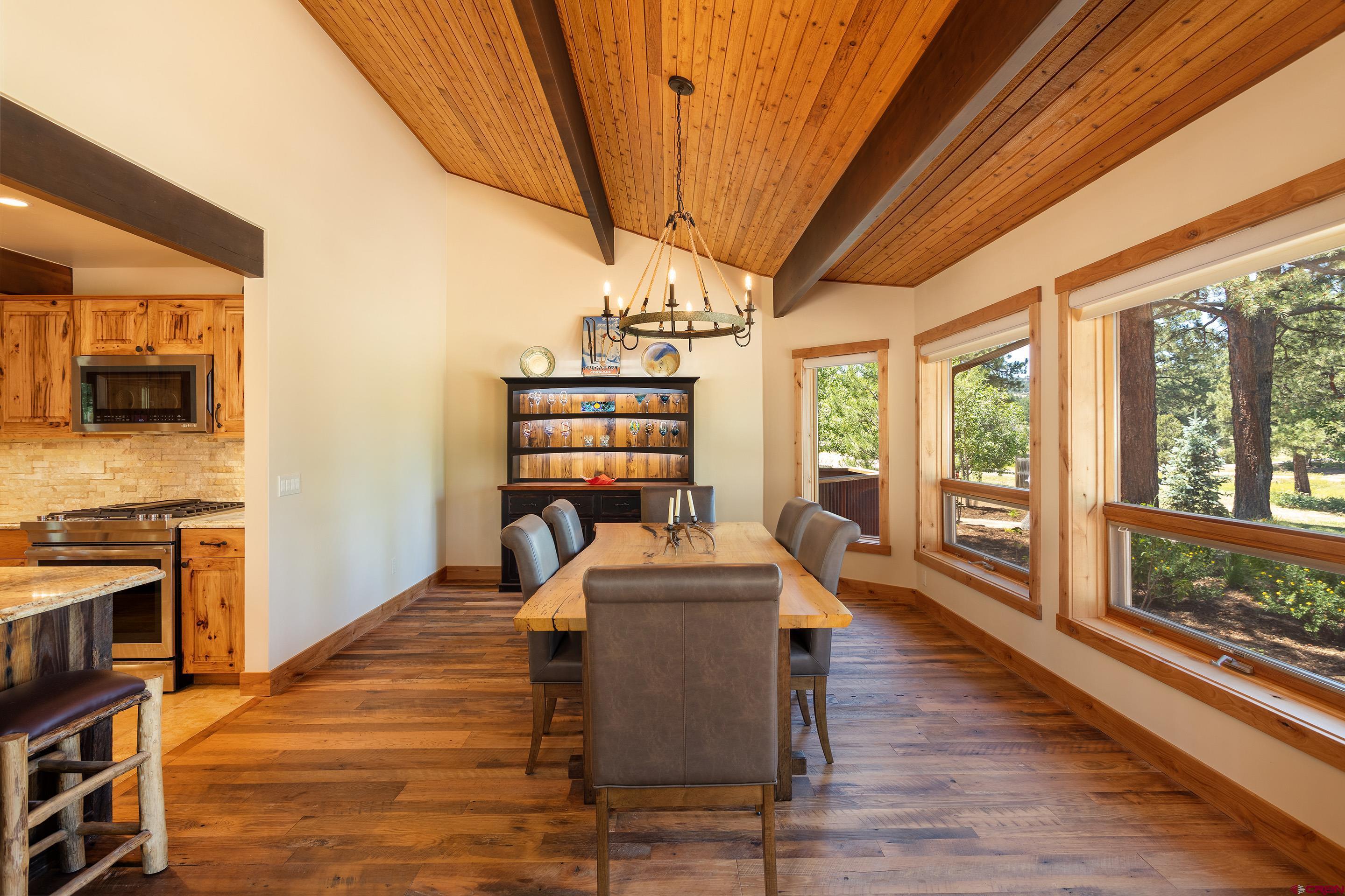 378 Colonial Drive Hesperus, CO 81326 - Photo 13 of 34 a dining room with furniture water view and wooden floor