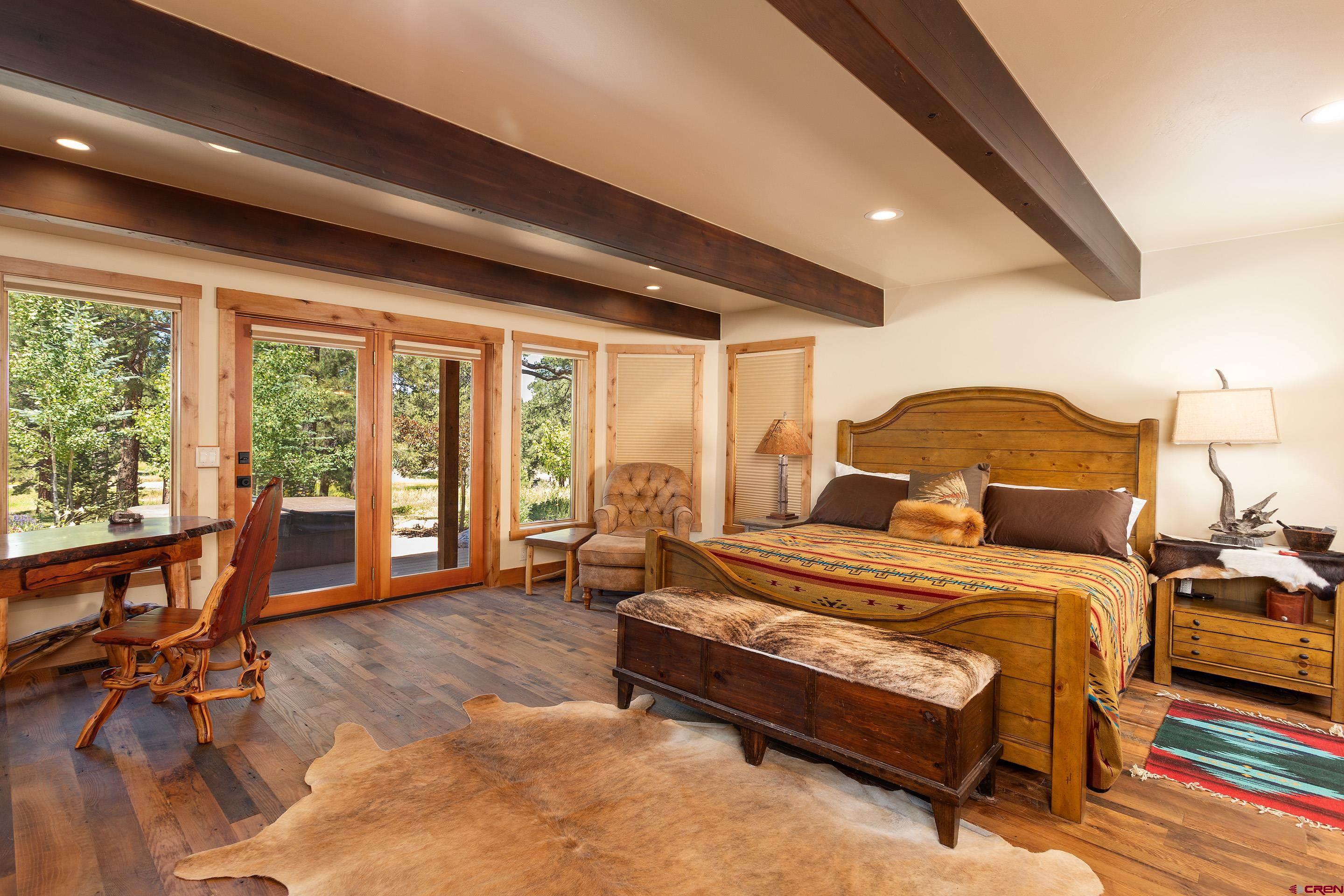 378 Colonial Drive Hesperus, CO 81326 - Photo 18 of 34 a bedroom with a bed and a large window