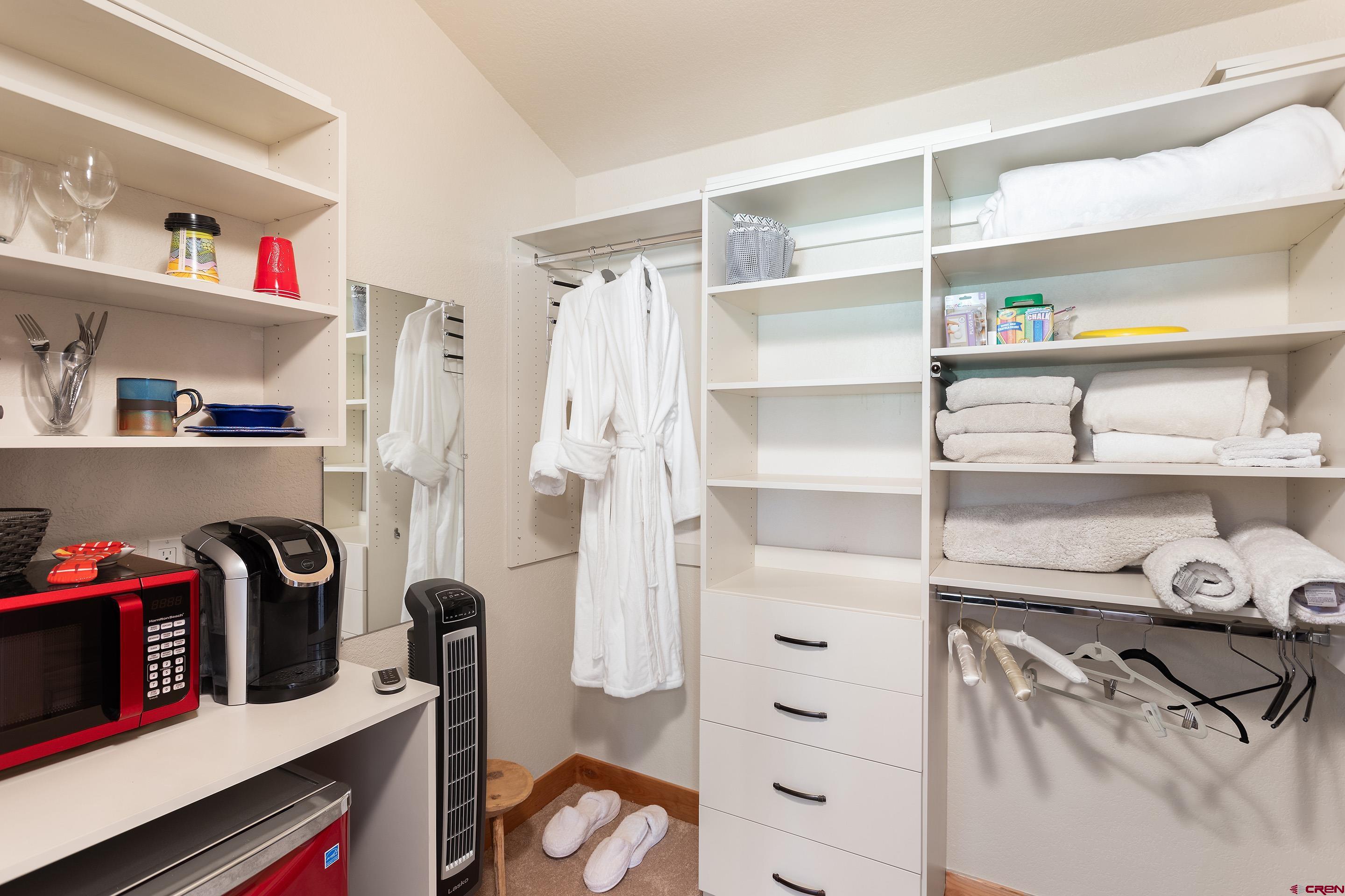 378 Colonial Drive Hesperus, CO 81326 - Photo 25 of 34 a view of walk in closet with clothes and shoes