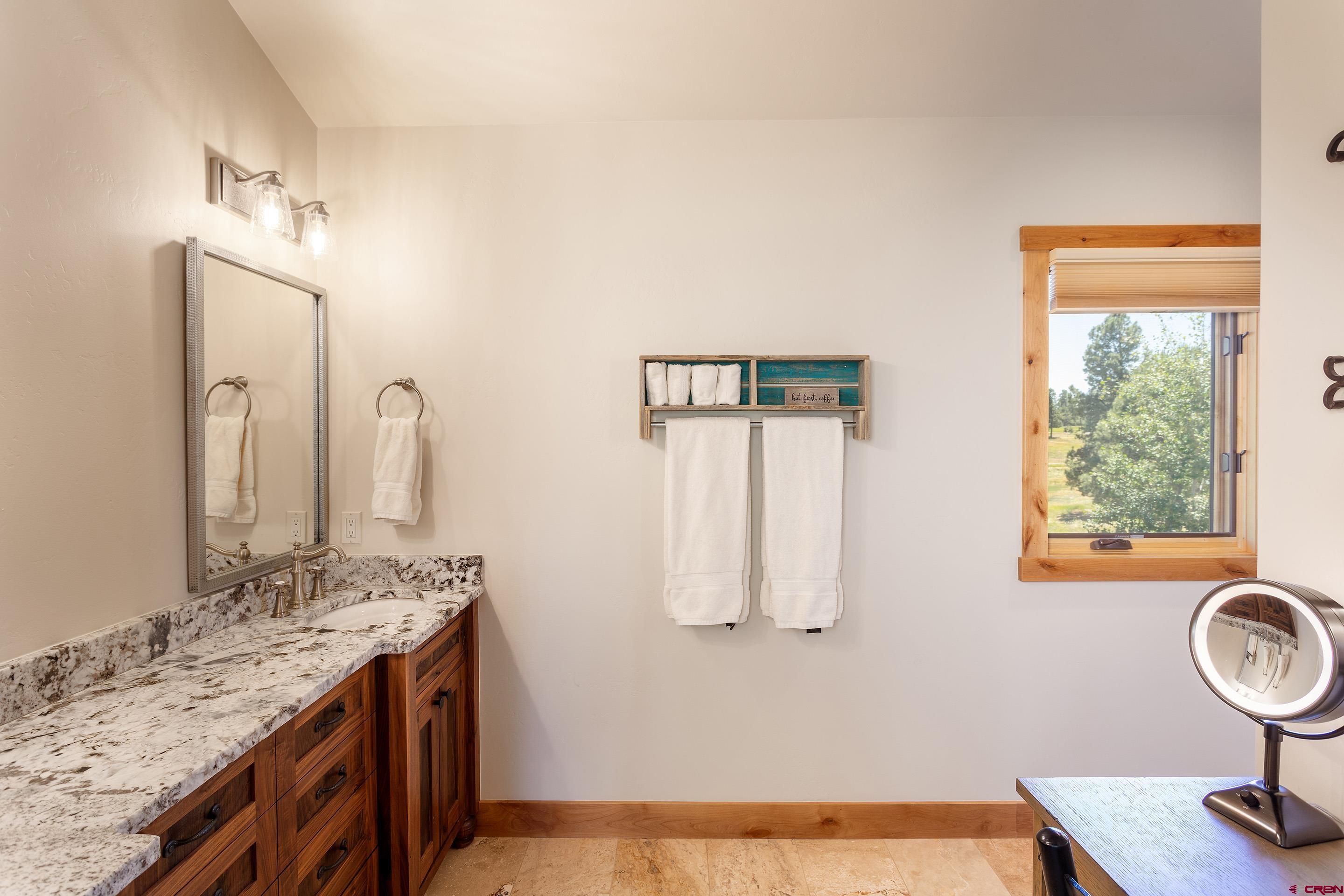 378 Colonial Drive Hesperus, CO 81326 - Photo 27 of 34 a bathroom with a sink and a mirror