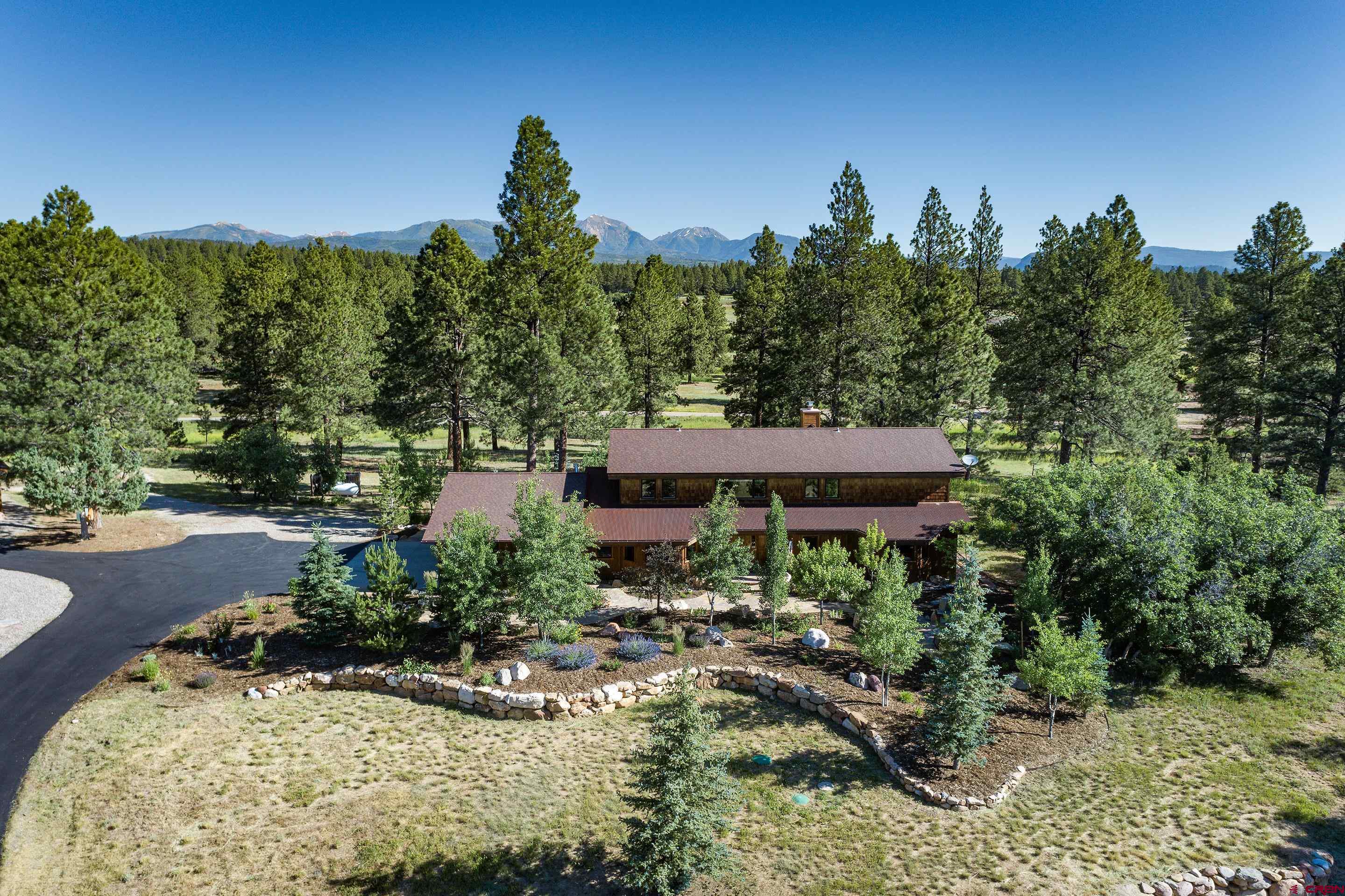 378 Colonial Drive Hesperus, CO 81326 - Photo 3 of 34 a view of a house with a yard and sitting area