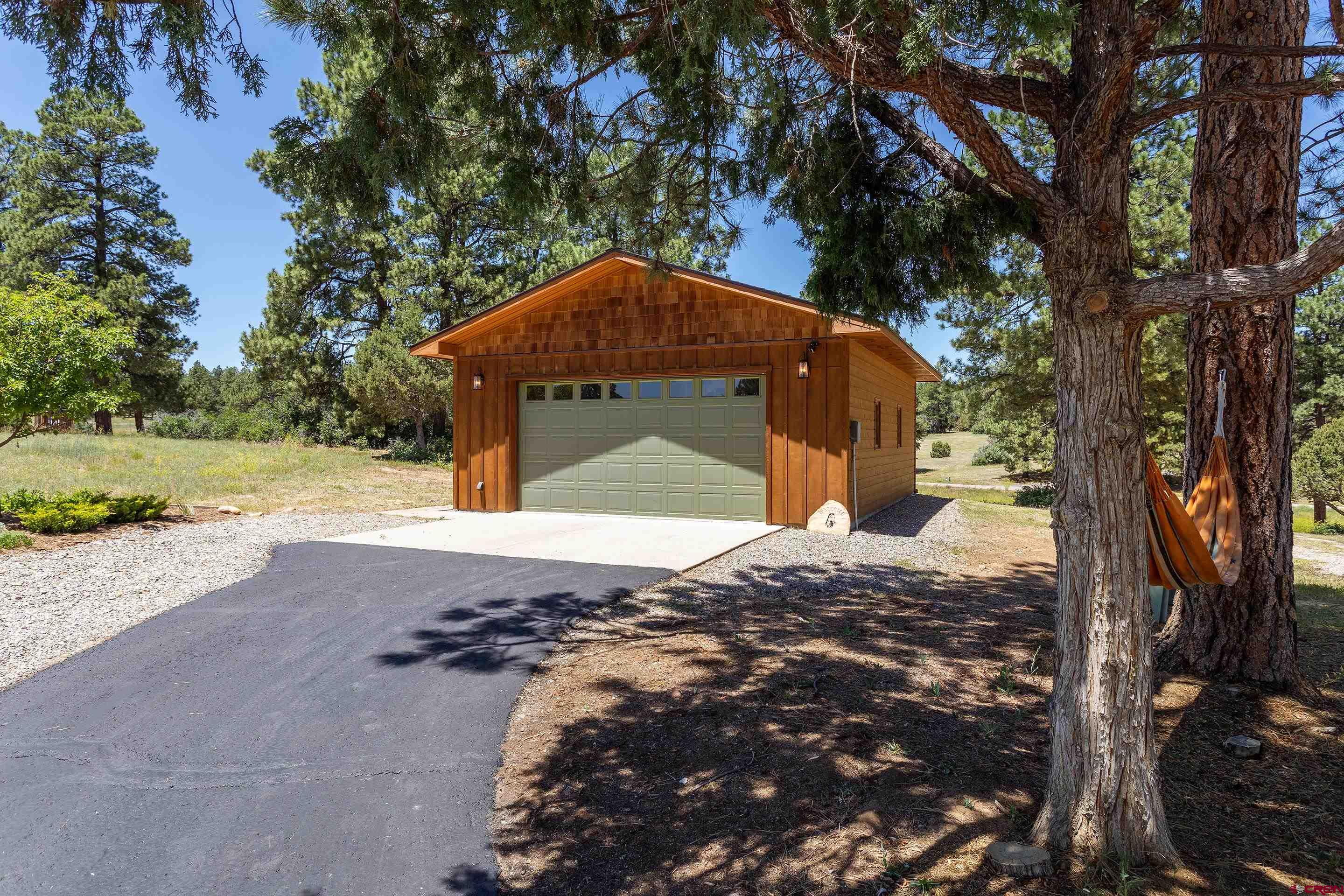 378 Colonial Drive Hesperus, CO 81326 - Photo 31 of 34 a backyard of a house with a yard and outdoor seating