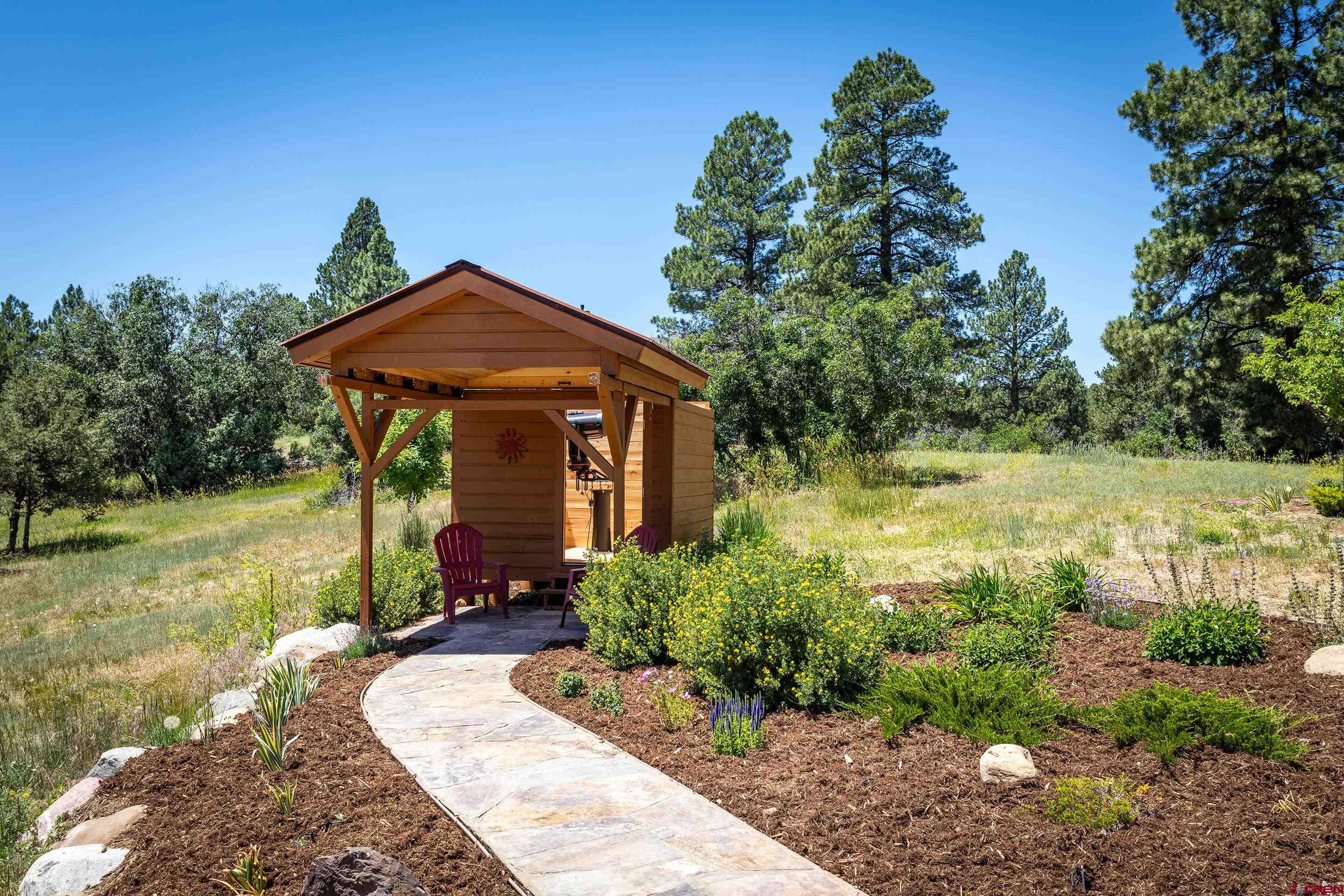 378 Colonial Drive Hesperus, CO 81326 - Photo 32 of 34 a front view of a house with garden