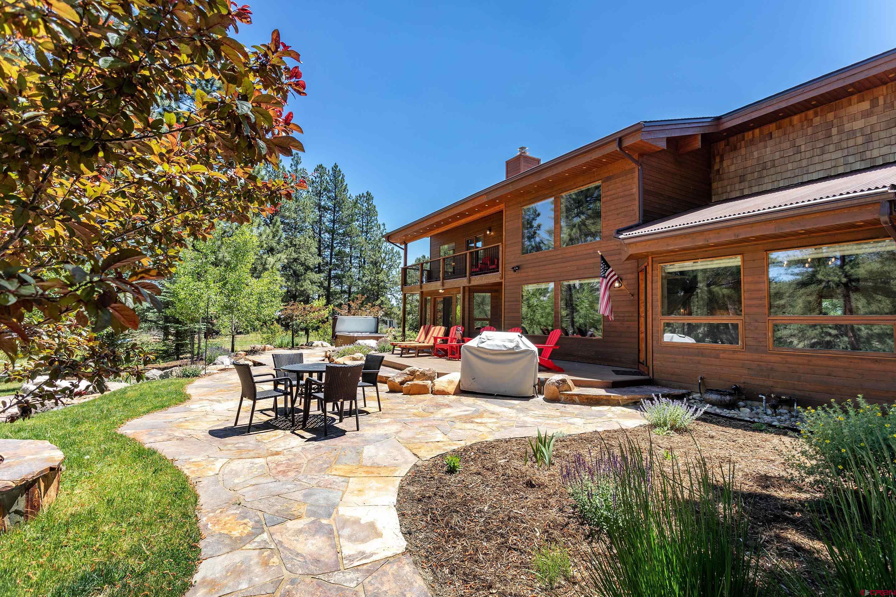 378 Colonial Drive Hesperus, CO 81326 - Photo 4 of 34 a view of a house with backyard porch and sitting area