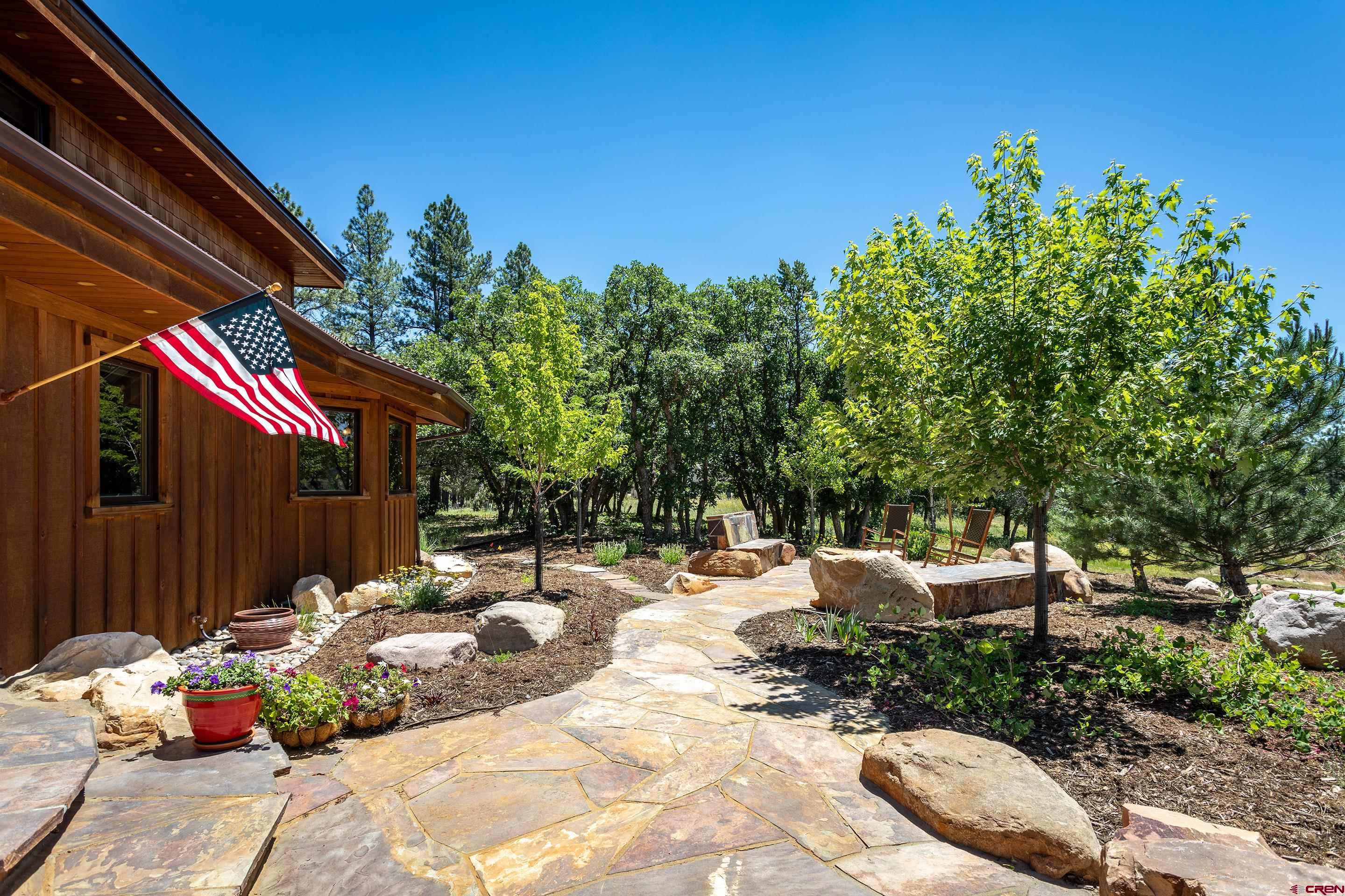 378 Colonial Drive Hesperus, CO 81326 - Photo 8 of 34 a view of a backyard with a chair and potted plants