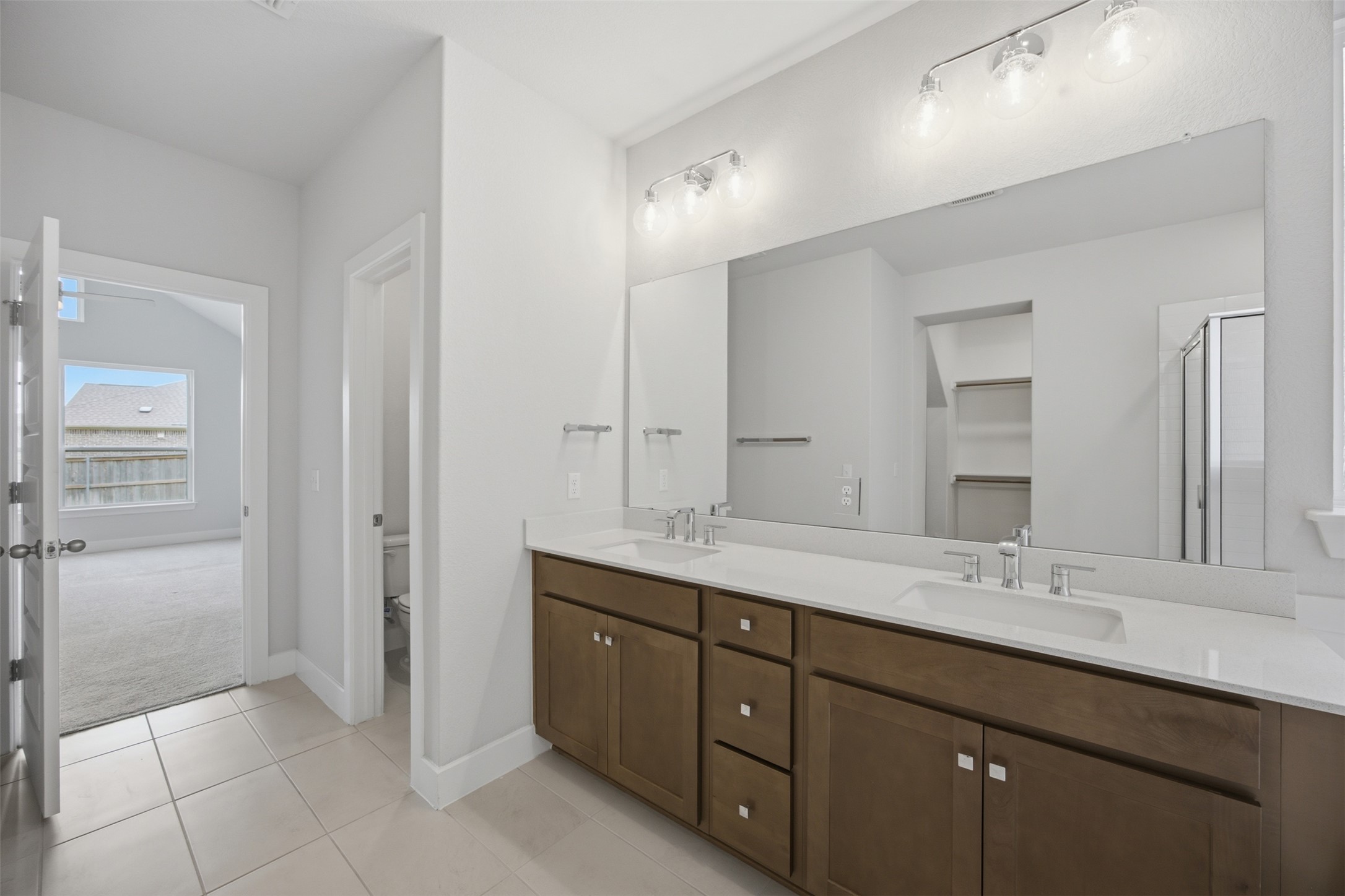 2101 Little Snake Way Georgetown, TX 78633 - Photo 23 of 37 Double vanity with ample counter space creates a serene and practical start to your day.