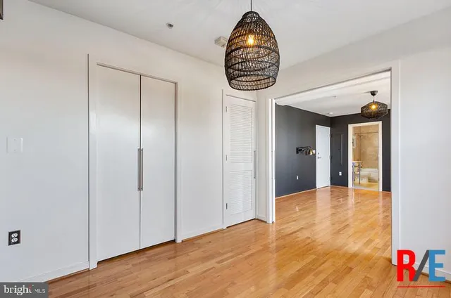 a view of an empty room and wooden floor