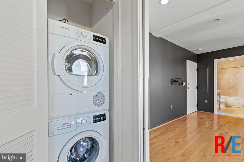 815 King Street, Unit 4C Alexandria, VA 22314 - Photo 14 of 27 a view of a bedroom with washer and dryer