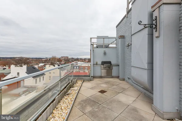 a view of balcony with furniture