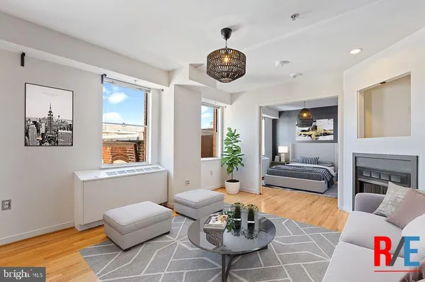 a living room with furniture and a large window