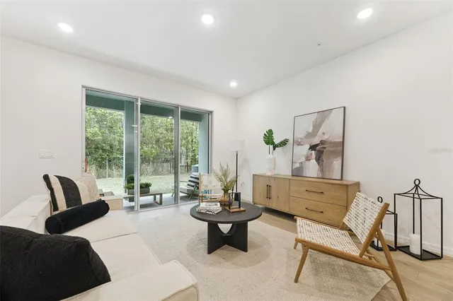 a living room with furniture and a large window