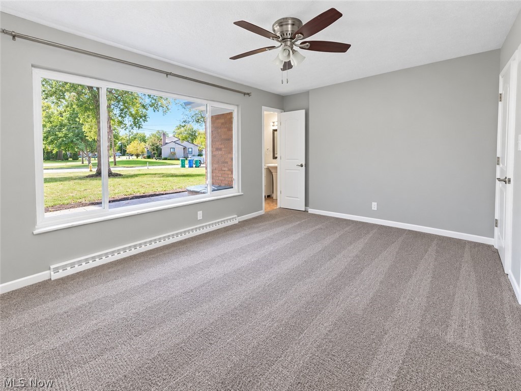2961 Chamberlain Road Akron, OH 44333 - Photo 13 of 18 3rd bedroom with carpet floors, large window to the front yard and ceiling fan. This bedroom also has a ensuite bathroom