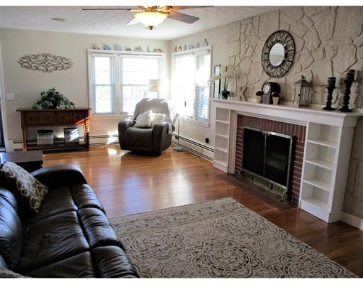 95 Powers Road Holden, MA 01520 - Photo 3 of 29 a living room with furniture and a fireplace