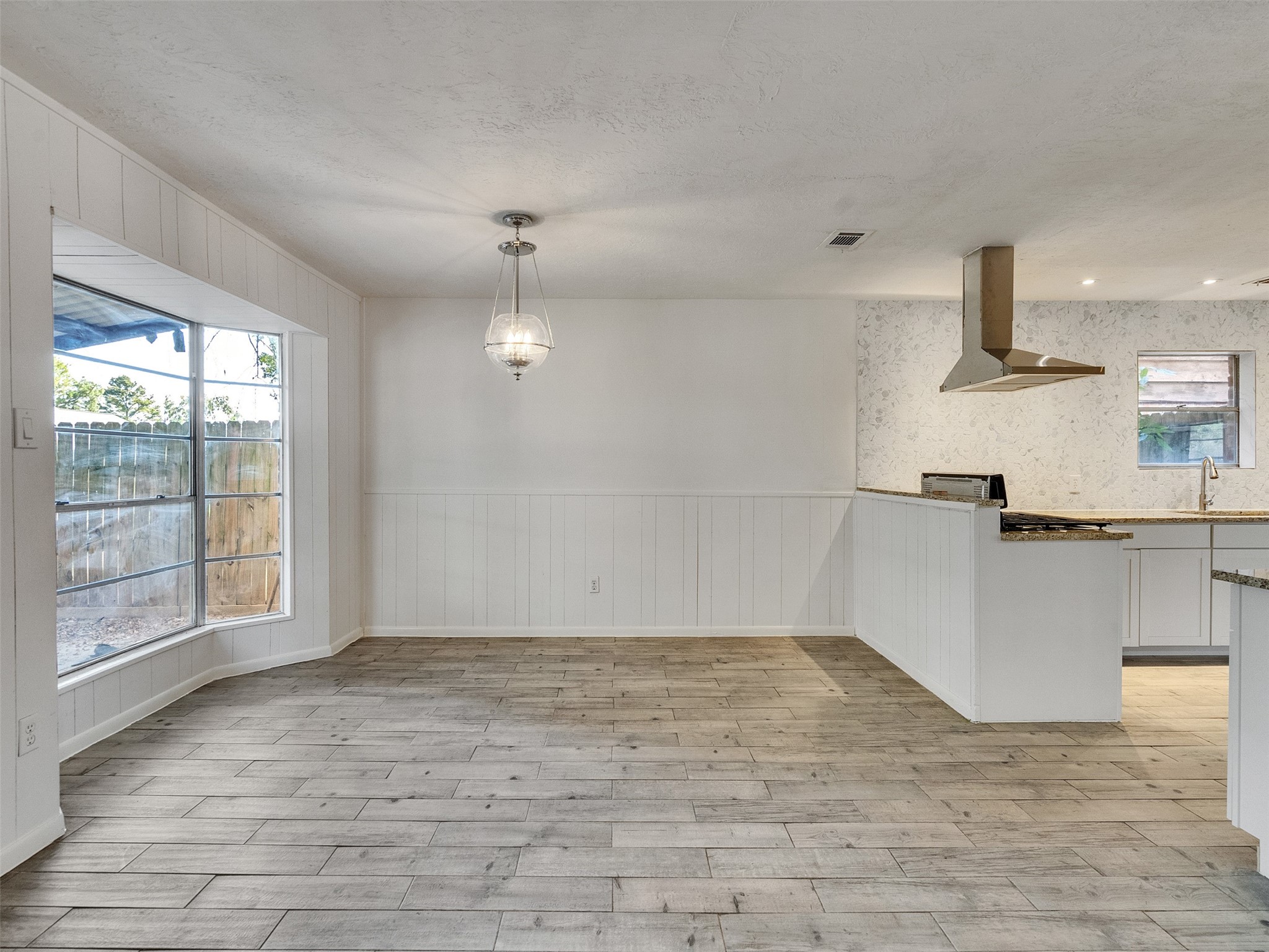12710 Crow Valley Lane Houston, TX 77099 - Photo 12 of 34 a view of empty room with wooden floor and fan