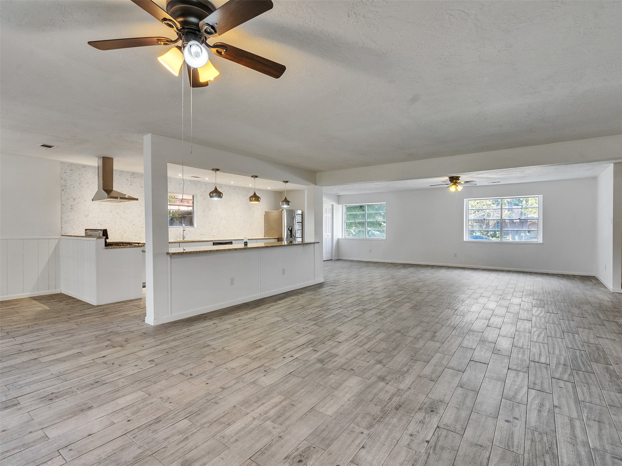 12710 Crow Valley Lane Houston, TX 77099 - Photo 15 of 34 a view of a kitchen with a stove cabinets and wooden floor