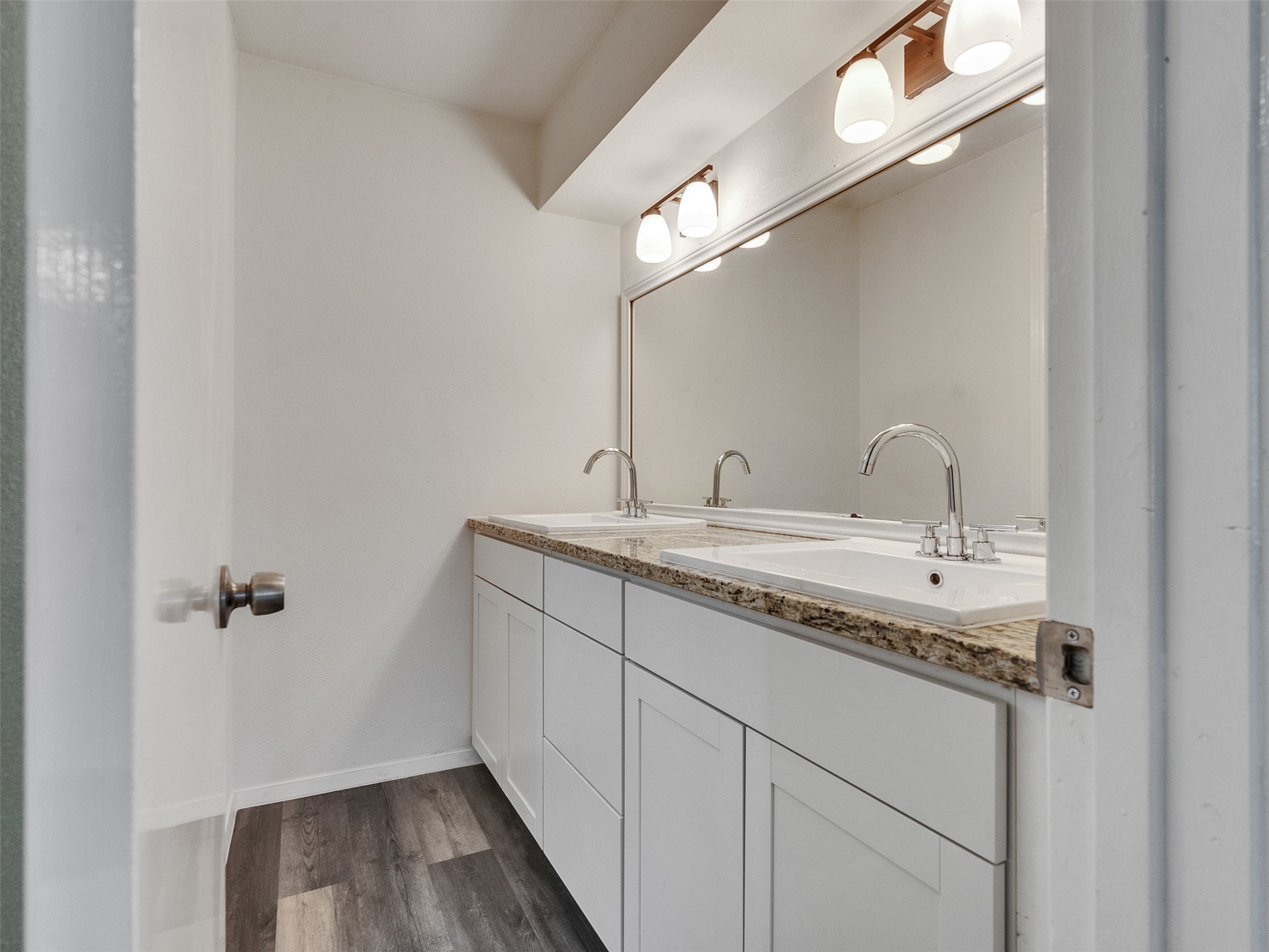 12710 Crow Valley Lane Houston, TX 77099 - Photo 24 of 34 a bathroom with a sink and mirror