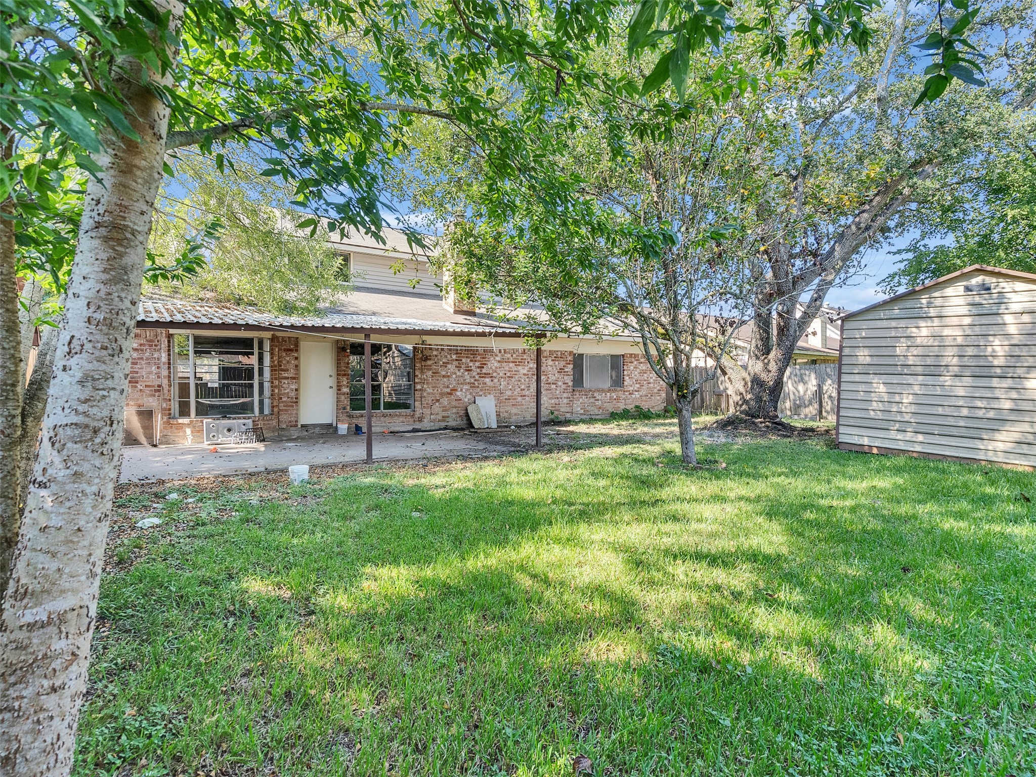 12710 Crow Valley Lane Houston, TX 77099 - Photo 28 of 34 front view of a house with a big yard