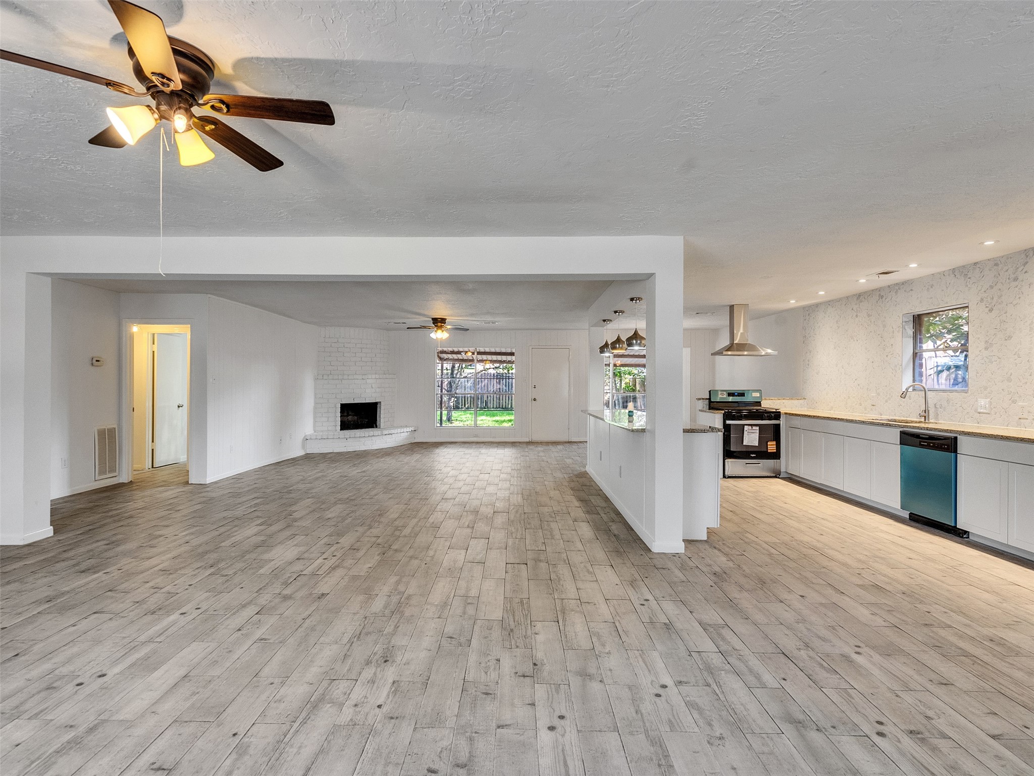 12710 Crow Valley Lane Houston, TX 77099 - Photo 6 of 34 a view of an empty room with window and cabinet