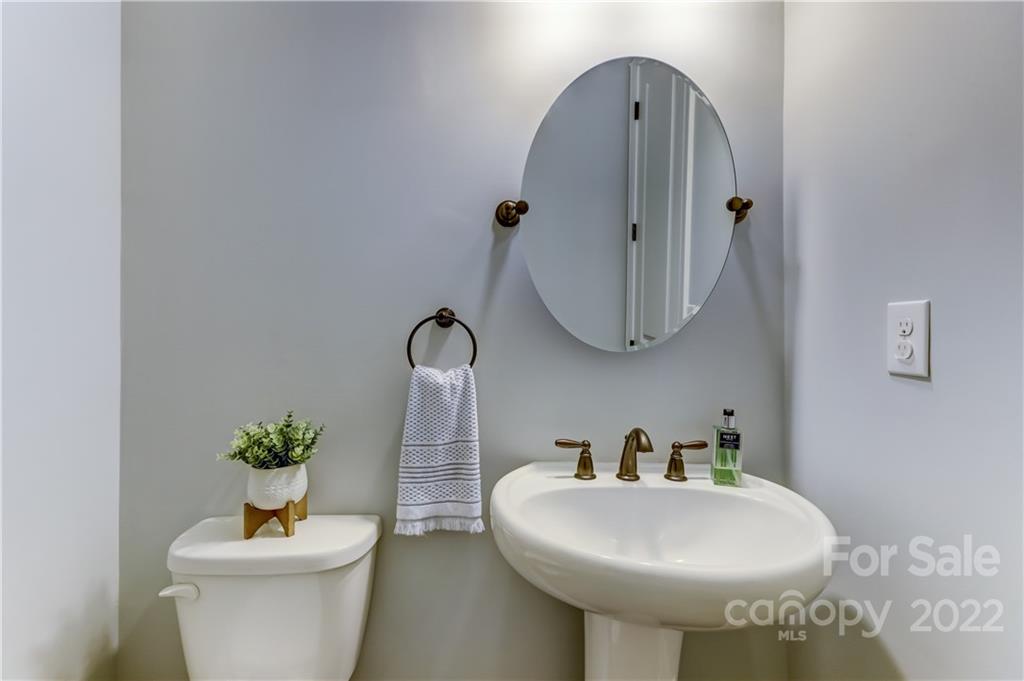 5266 Meadowcroft Way Fort Mill, SC 29708 - Photo 13 of 47 a bathroom with a toilet sink and mirror