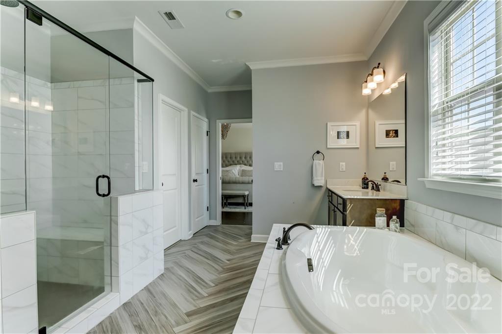 5266 Meadowcroft Way Fort Mill, SC 29708 - Photo 34 of 47 a spacious bathroom with a tub sink and shower
