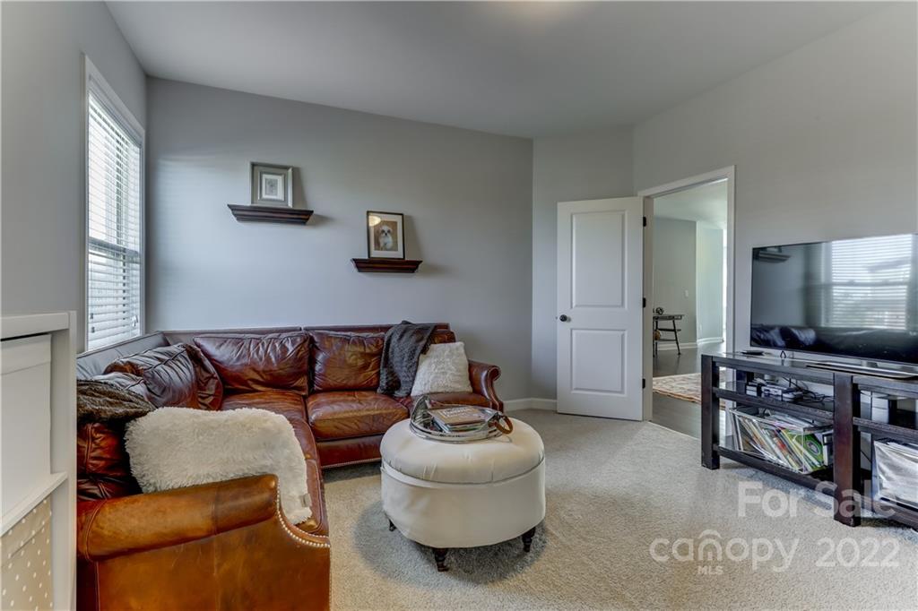 5266 Meadowcroft Way Fort Mill, SC 29708 - Photo 36 of 47 a living room with furniture and a flat screen tv