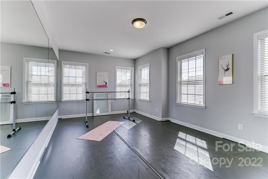 5266 Meadowcroft Way Fort Mill, SC 29708 - Photo 39 of 47 a view of an empty room with a window and wooden floor