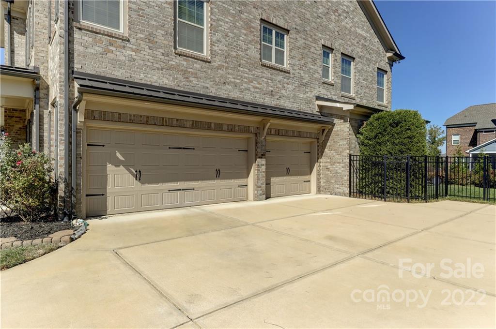 5266 Meadowcroft Way Fort Mill, SC 29708 - Photo 42 of 47 a front view of a house with a yard and garage