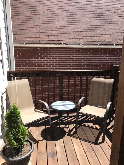 1356 North Cleveland Avenue, Unit 2 Chicago, IL 60610 - Photo 11 of 15 a view of a patio with couple of chairs