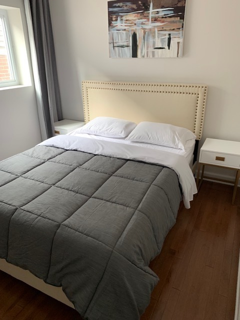 1356 North Cleveland Avenue, Unit 2 Chicago, IL 60610 - Photo 12 of 15 a bedroom with a bed and a window