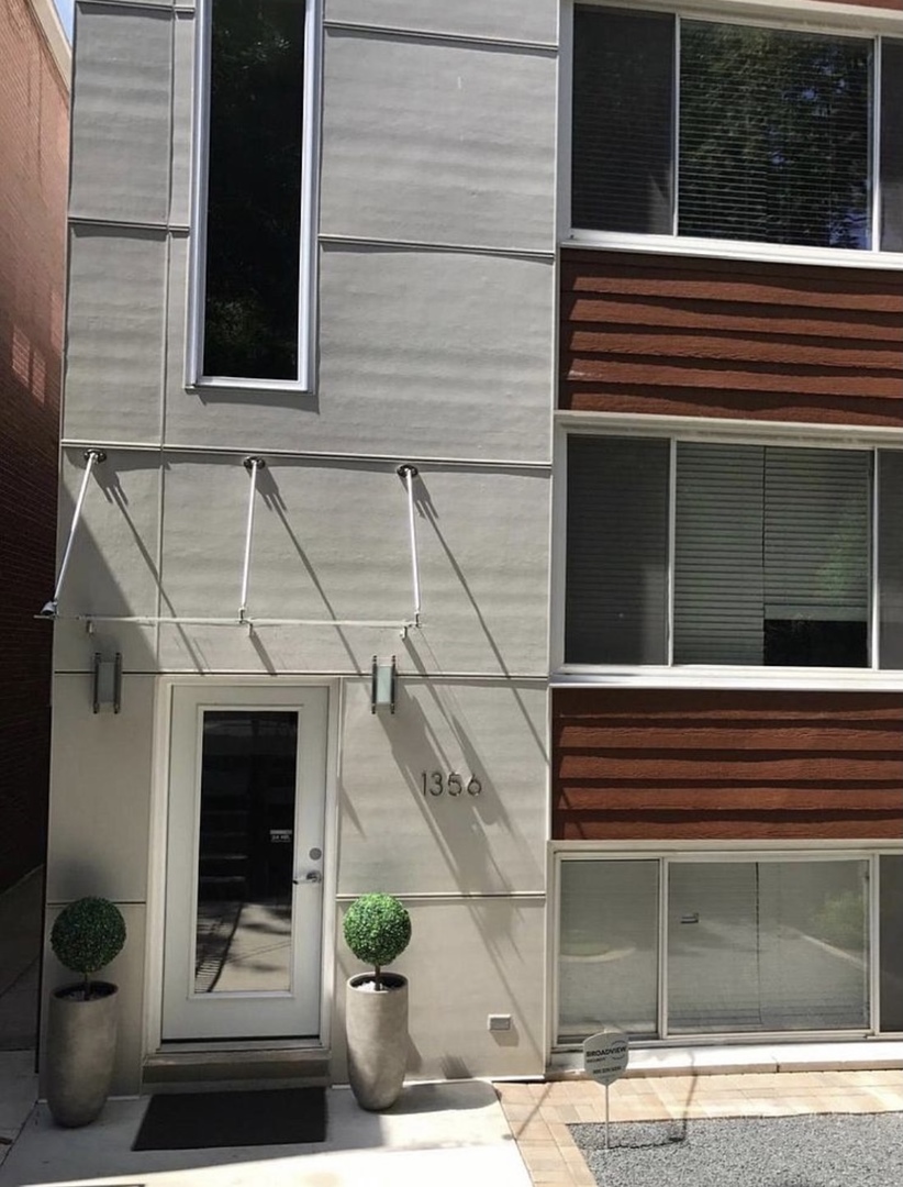 1356 North Cleveland Avenue, Unit 2 Chicago, IL 60610 - Photo 2 of 15 a side view of a house with a window and a door