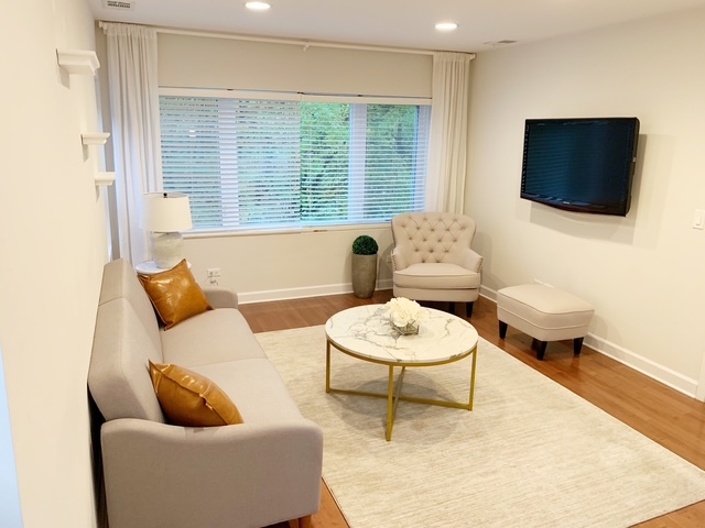 1356 North Cleveland Avenue, Unit 2 Chicago, IL 60610 - Photo 3 of 15 a living room with furniture and a flat screen tv