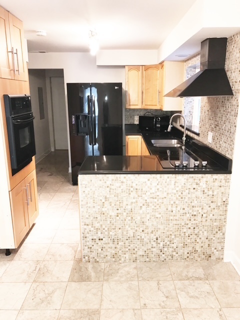 1356 North Cleveland Avenue, Unit 2 Chicago, IL 60610 - Photo 5 of 15 a view of a kitchen with a sink and cabinets