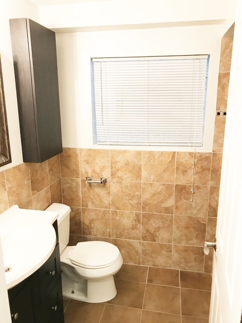 1356 North Cleveland Avenue, Unit 2 Chicago, IL 60610 - Photo 7 of 15 a bathroom with a toilet a sink and a shower