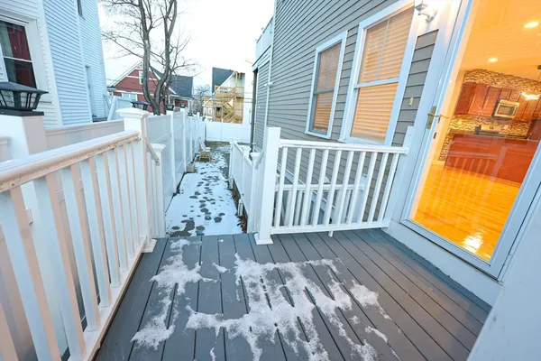 a view of a balcony with wooden floor