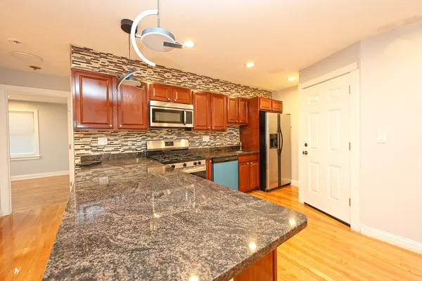 a view of kitchen and kitchen with sink