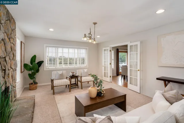 a bedroom with furniture and a window