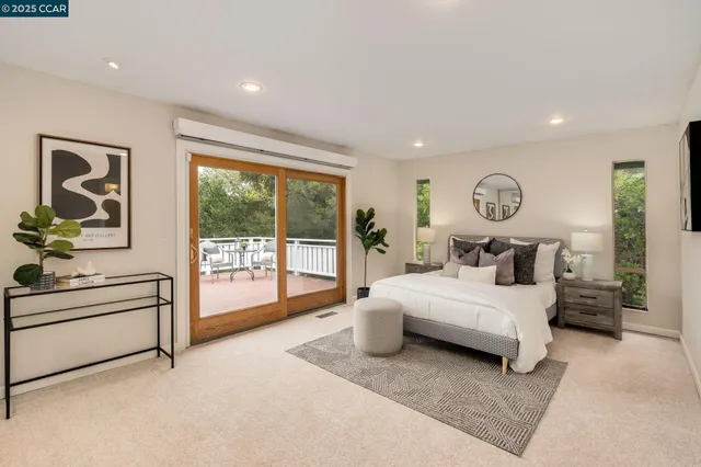 a bathroom with a granite countertop double vanity sink mirror and toilet