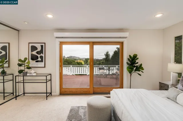 a bathroom with a granite countertop sink a mirror and shower
