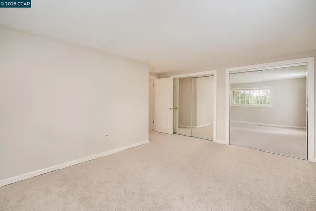 a view of a balcony with mountain view and wooden floor