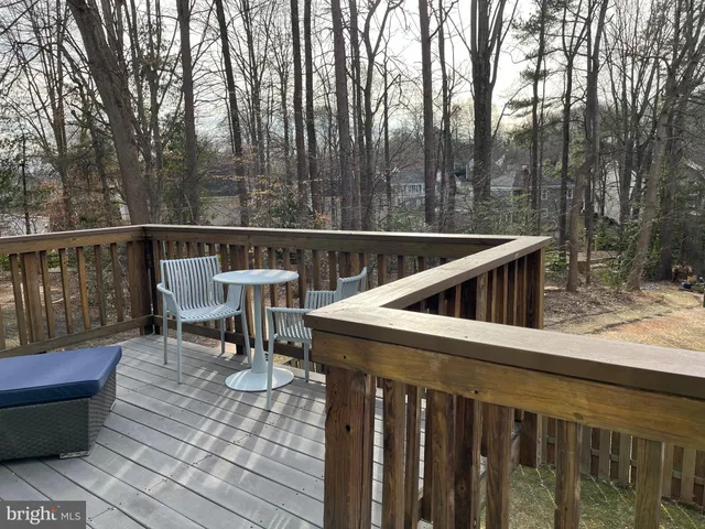 a kitchen with stainless steel appliances granite countertop a sink and a refrigerator