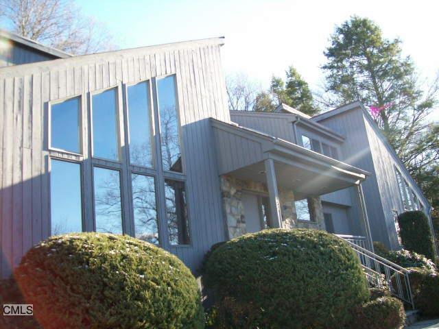 695 Hunting Ridge Road Stamford, CT 06903 - Photo 1 of 1 a view of a front door and wooden fence